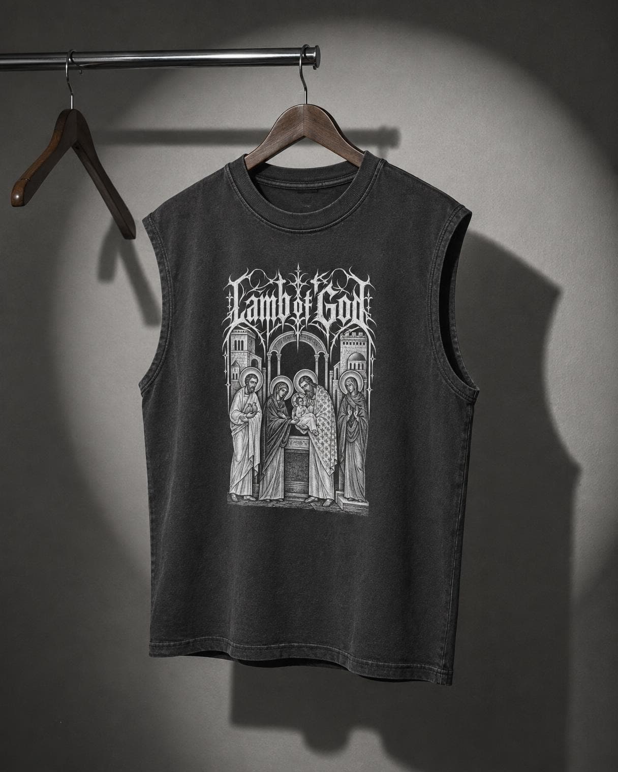 Lamb of God Temple Muscle Tee hanging on a rail under a studio spotlight