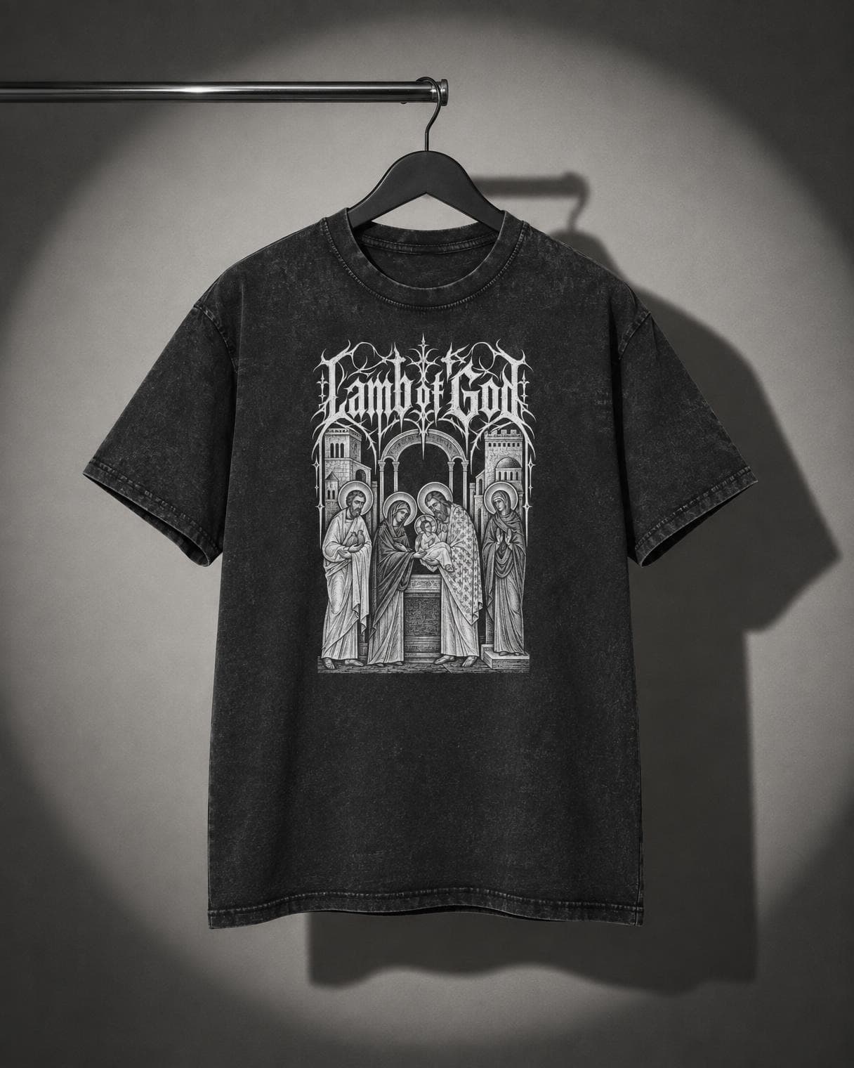 Lamb of God Temple Tee hanging on a rail under a studio spotlight